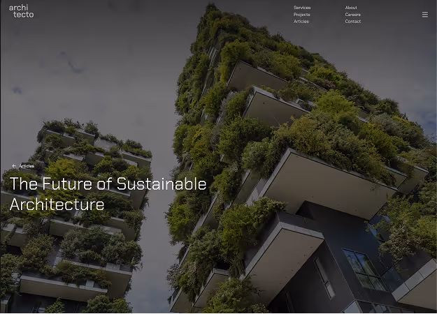 Two modern high-rise buildings covered with dense greenery and plants on balconies under a cloudy sky.